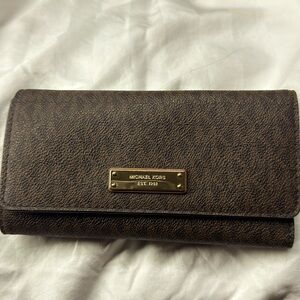 Beautiful, black and brown Michael Kors wallet never used